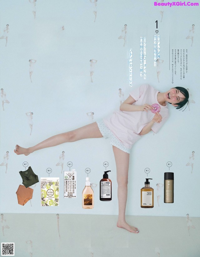 A woman in a pink shirt is posing for a magazine advertisement.