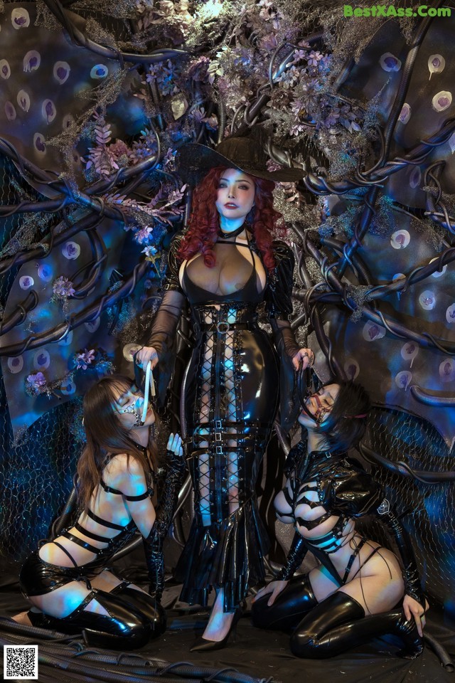 A group of women dressed in latex posing for a picture.